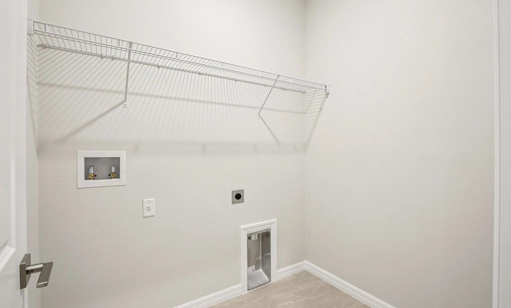 Laundry room with tile flooring