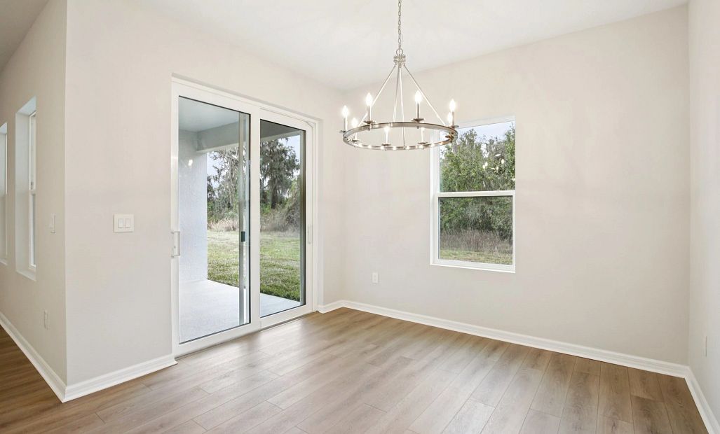Dining space right off the kitchen and welcomes you out to the covered back lanai perfect for indoor