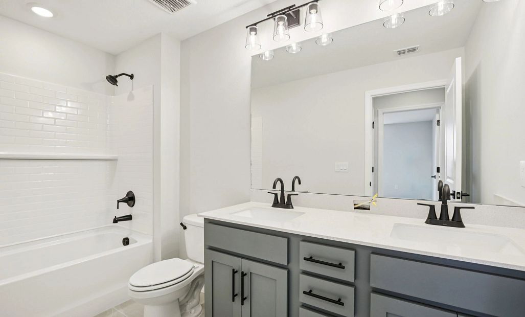 Bathroom 2 featuring double sinks and aspects of the AW Collection® Minimalist