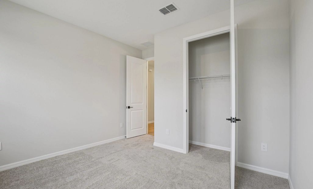 Spacious guest bedroom and closet