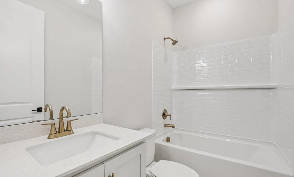Bathroom 3 located off the foyer featuring aspects of the AW Collection® Serene
