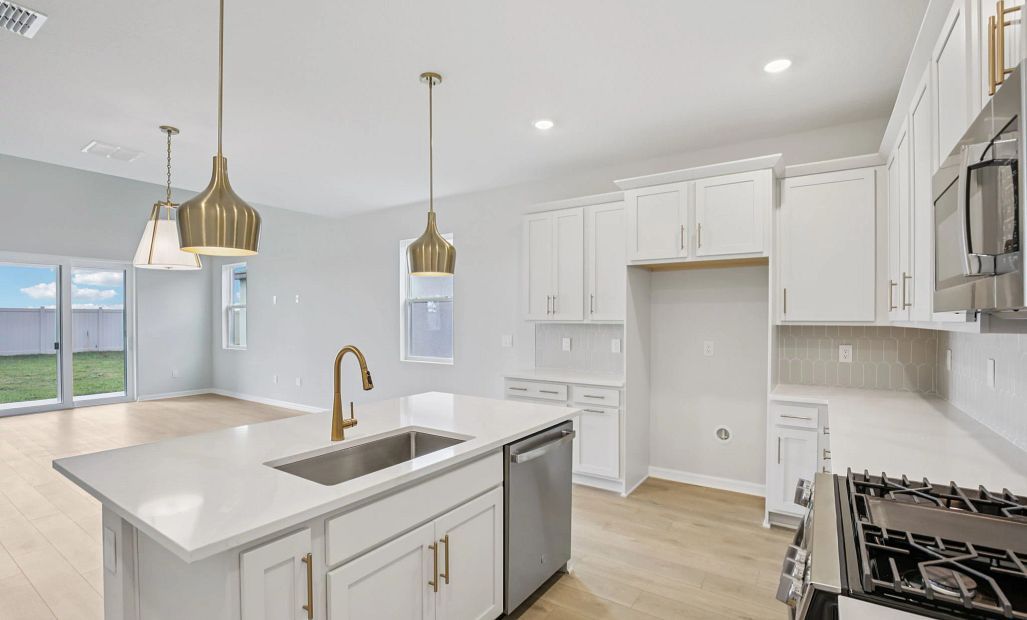 spacious kitchen layout featuring AW Collection® Serene