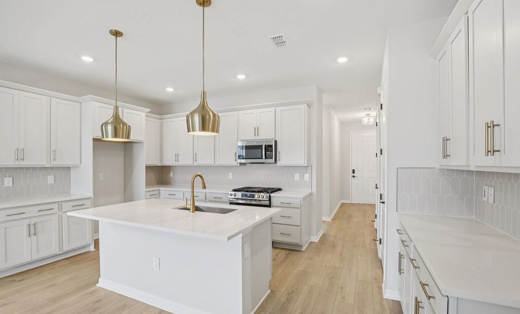 Ample cabinet and countertop space in this kitchen featuring AW Collection® Serene