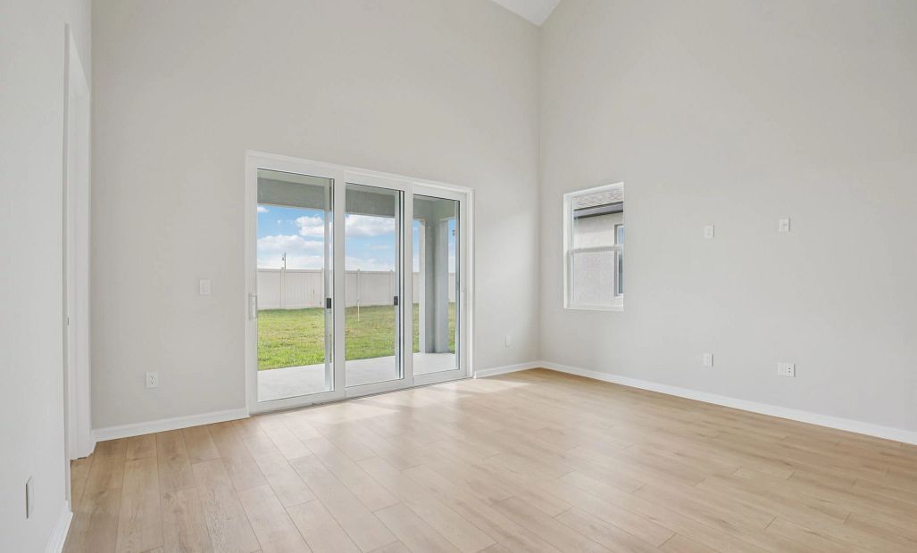 Bright and open family room space with a large sliding glass door