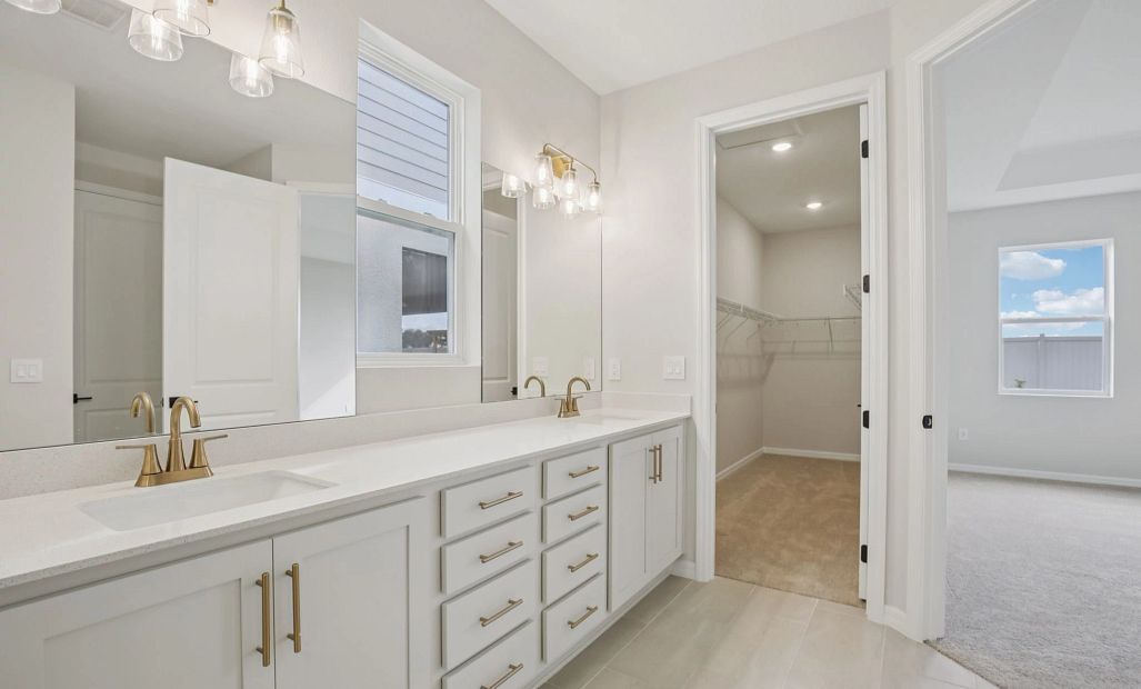 Walk-in closet located off the primary bathroom