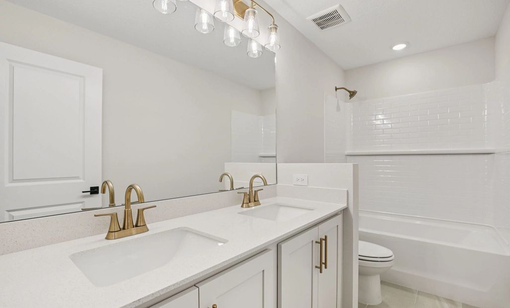 Bathroom 2 with double sinks and featuring AW Collection® Serene