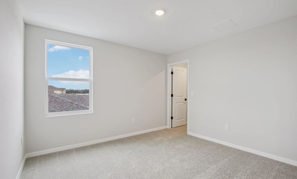 Bedroom 3 with a walk-in closet