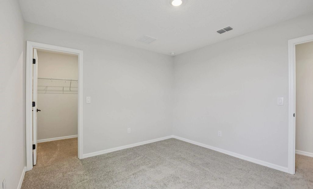 Bedroom 3 and walk-in closet
