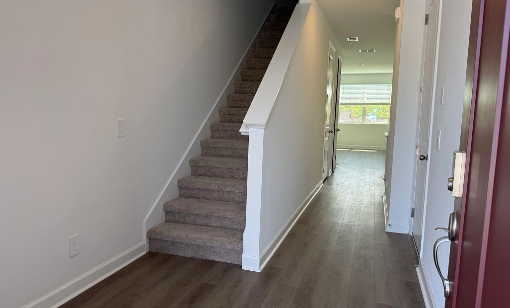 Front entry opens up into bright and airy foyer
