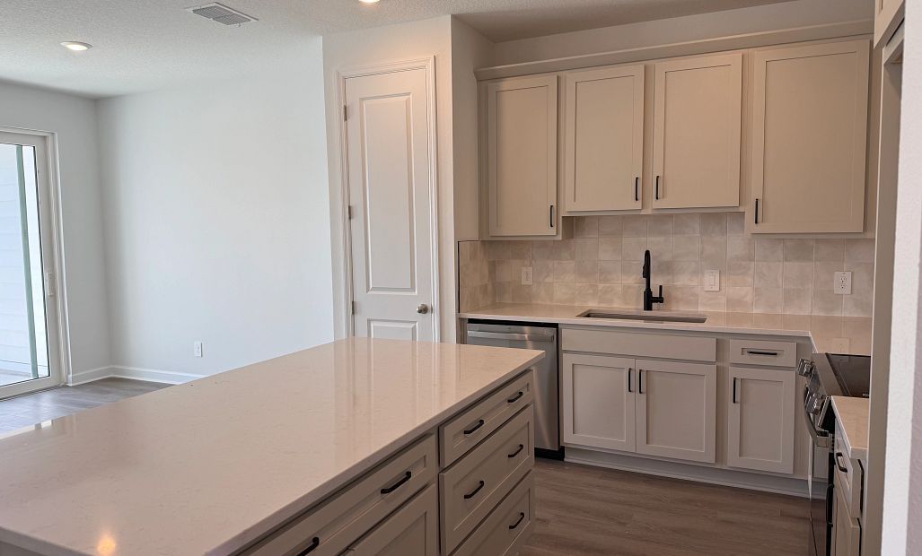 Foyer leads into stunning kitchen, featuring AW Collection® Artisan
