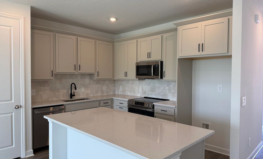 Sophisticated kitchen features a large island and ample cabinetry, ideal for any home chef