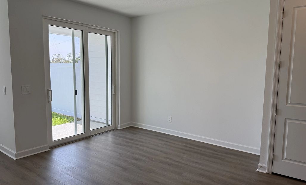 Sun-filled dining space with easy access to back patio