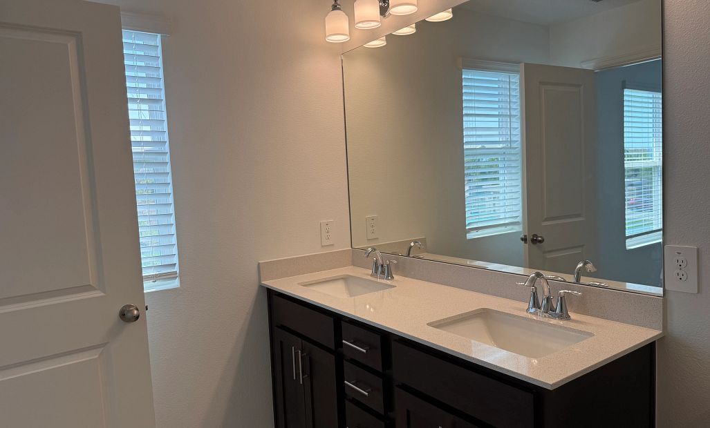 Elegant dual sink vanity in primary bath