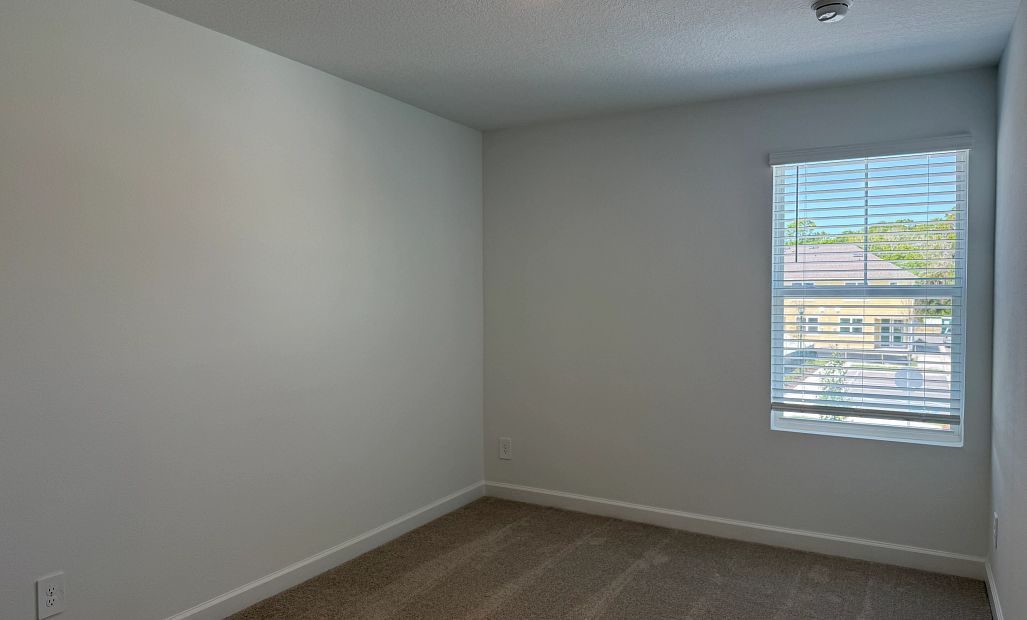 Bedroom 3 features a generous walk-in closet
