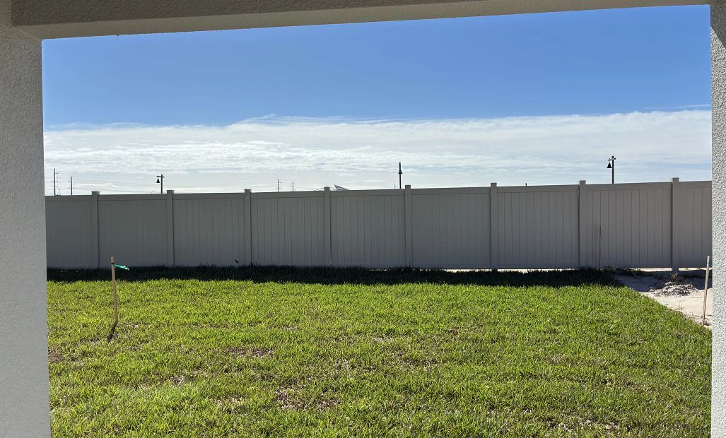 Spacious backyard with privacy fence