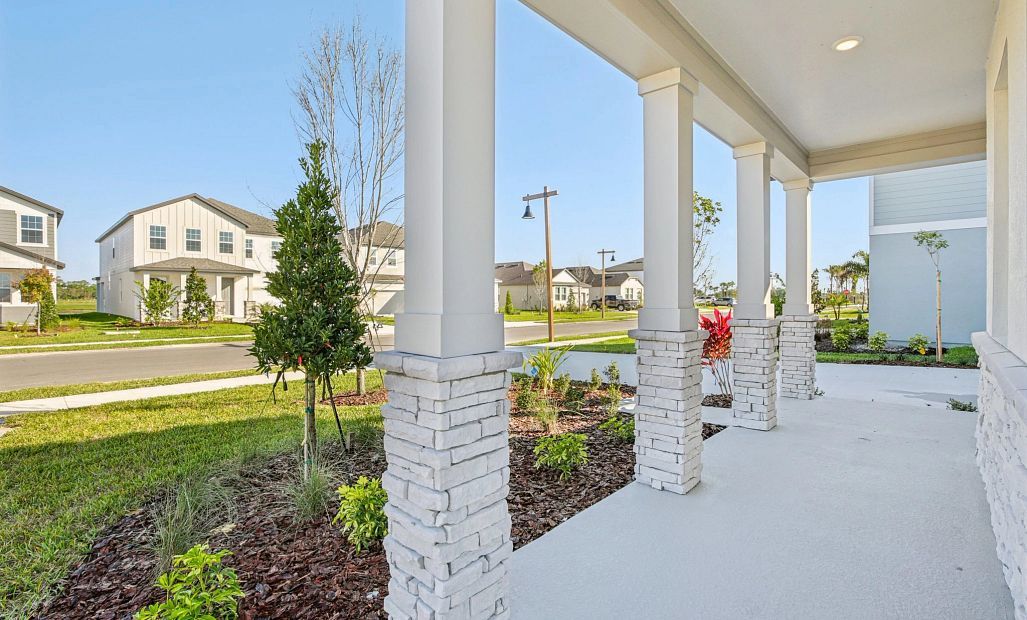Monroe R elevation featuring a beautiful 4 post covered front porch