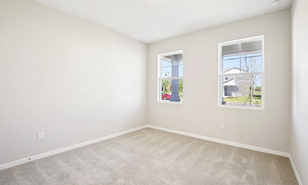 Bedroom 3 located on the front of the home with two windows