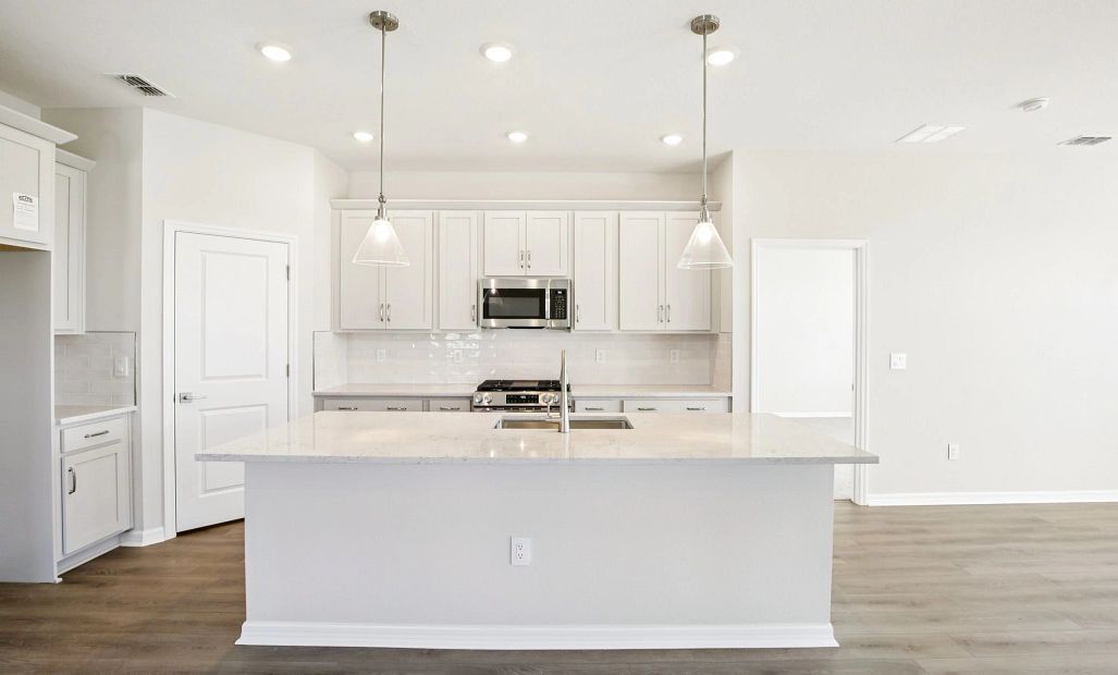 Gorgeous kitchen featuring a large island and the AW Collection® Milan