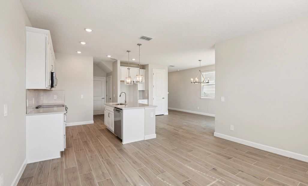 Family room space is located off the kitchen and opens up into the dining space as well