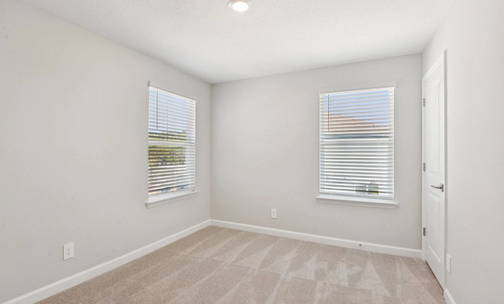 Bedroom 2 features two windows