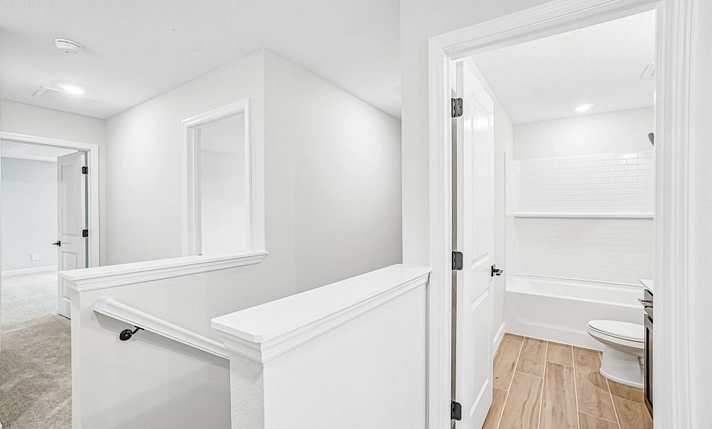 At the top of the stairs you will find a landing that takes you into the bed and bathrooms