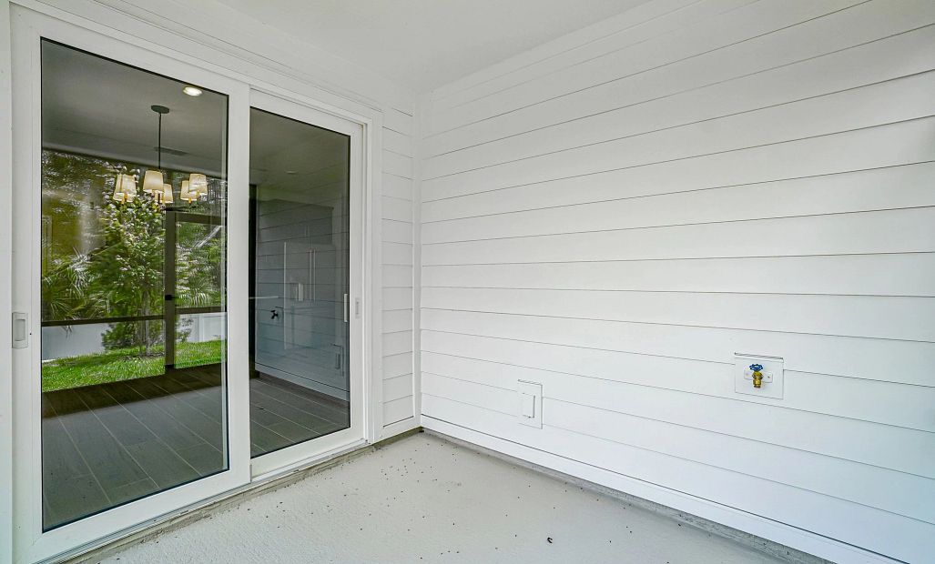 Large sliding glass doors welcome you on to the spacious covered and screened in lanai