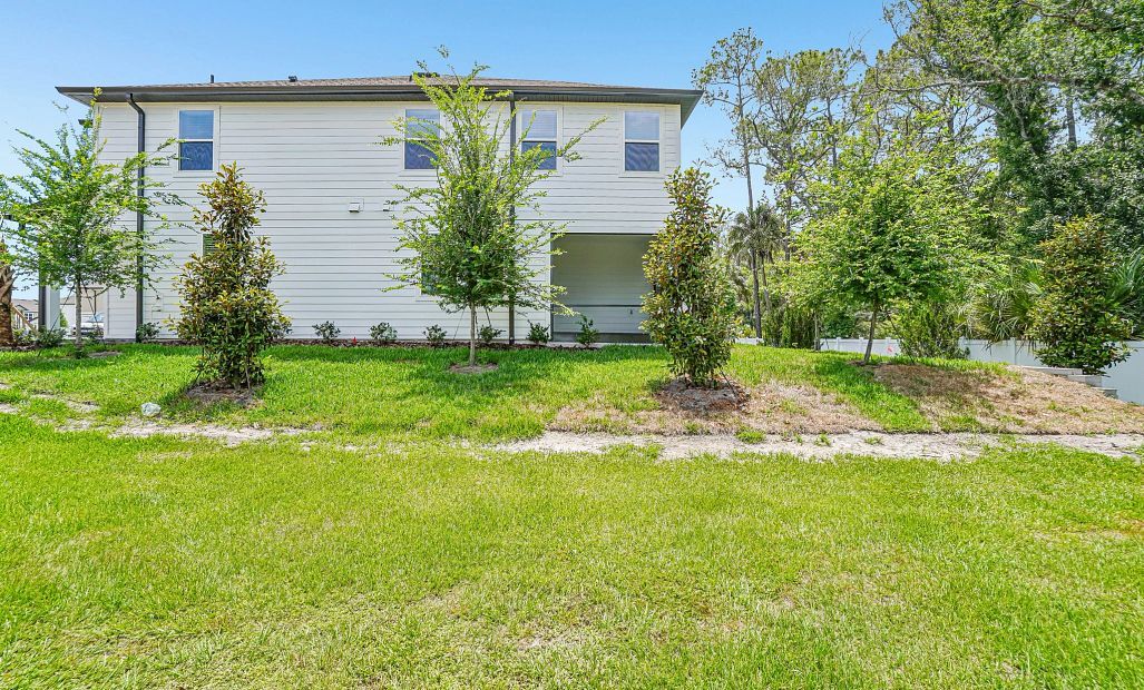 The side yard takes you out on to the neighborhood walking trail