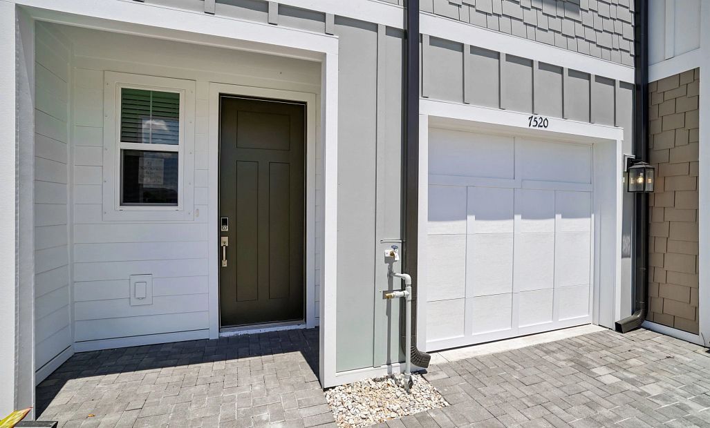 Covered front porch and one car garage