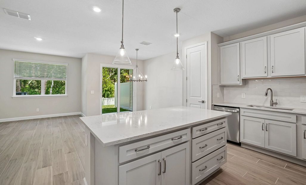 Beautiful kitchen welcomes you in to this open concept space