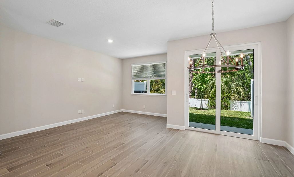 Dining space opens up into the family room