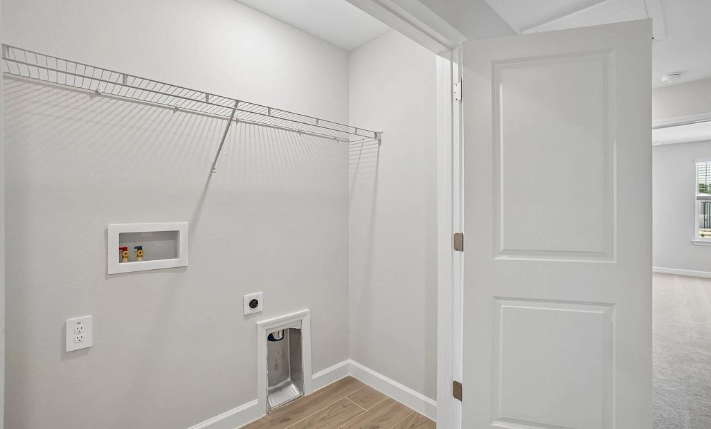 Laundry closet located off the upstairs hallway