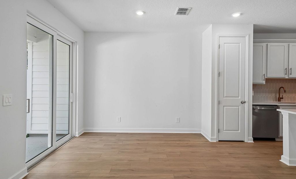 Dining space located off the kitchen and looking out on to the covered lanai -  representative