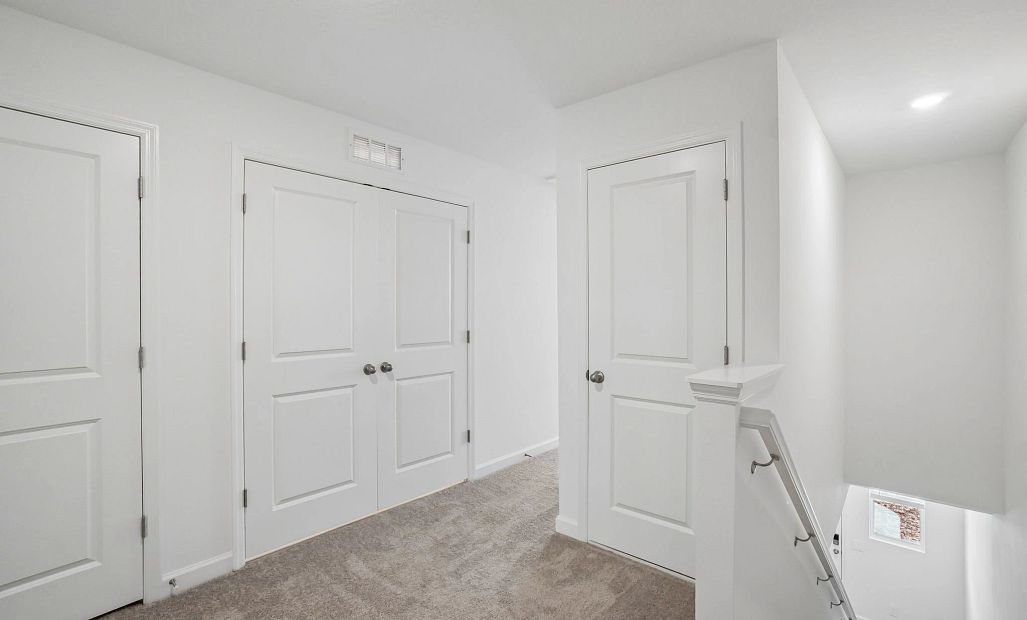Upstairs you will find a loft space that directs you to the primary and secondary bedrooms -