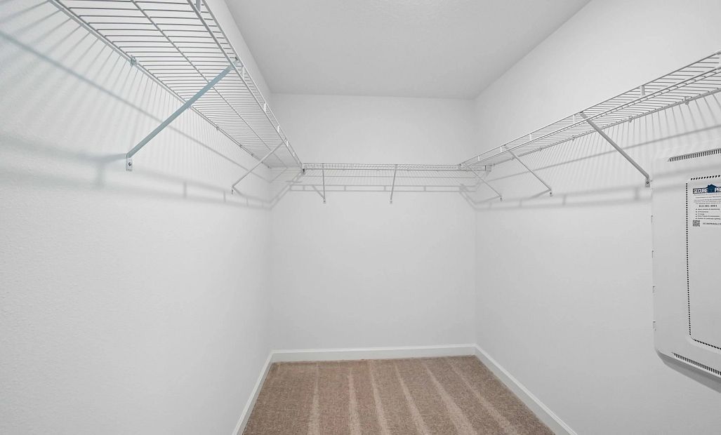 Large walk-in closet located off the primary bedroom -  representative images