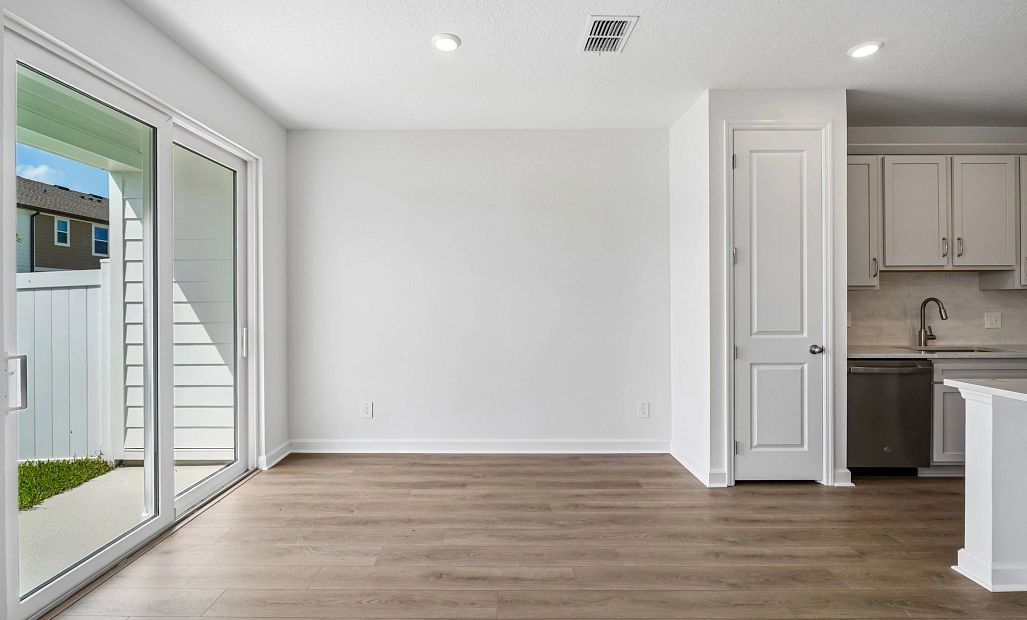 Off the kitchen is the dining room space