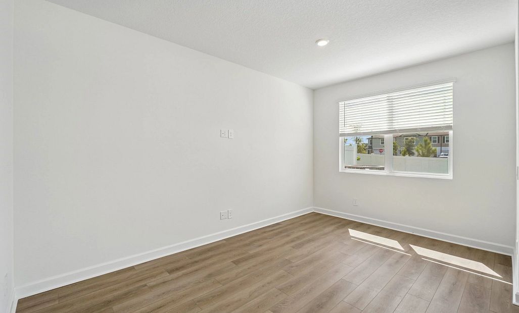 Spacious family room space with a double window for extra natural lighting