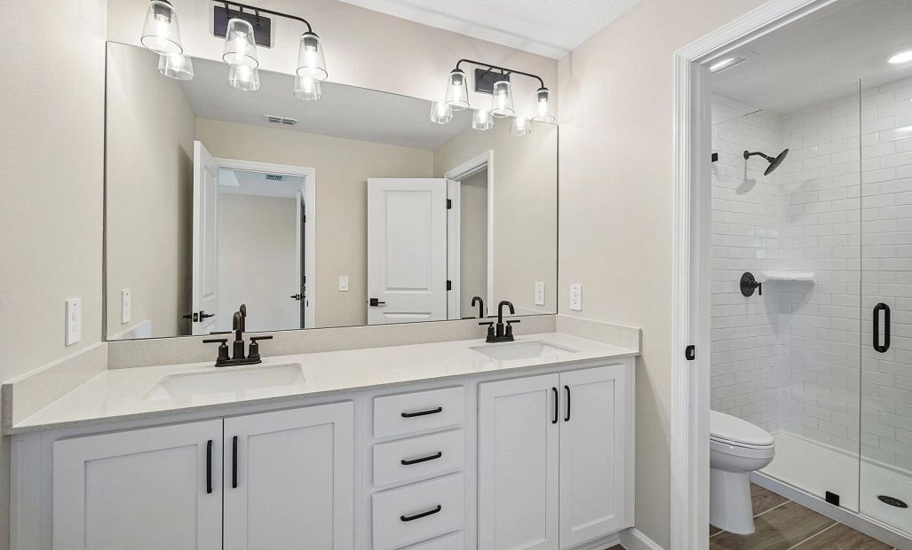 Primary bathroom features aspects of AW Collection® Harmony and double sinks