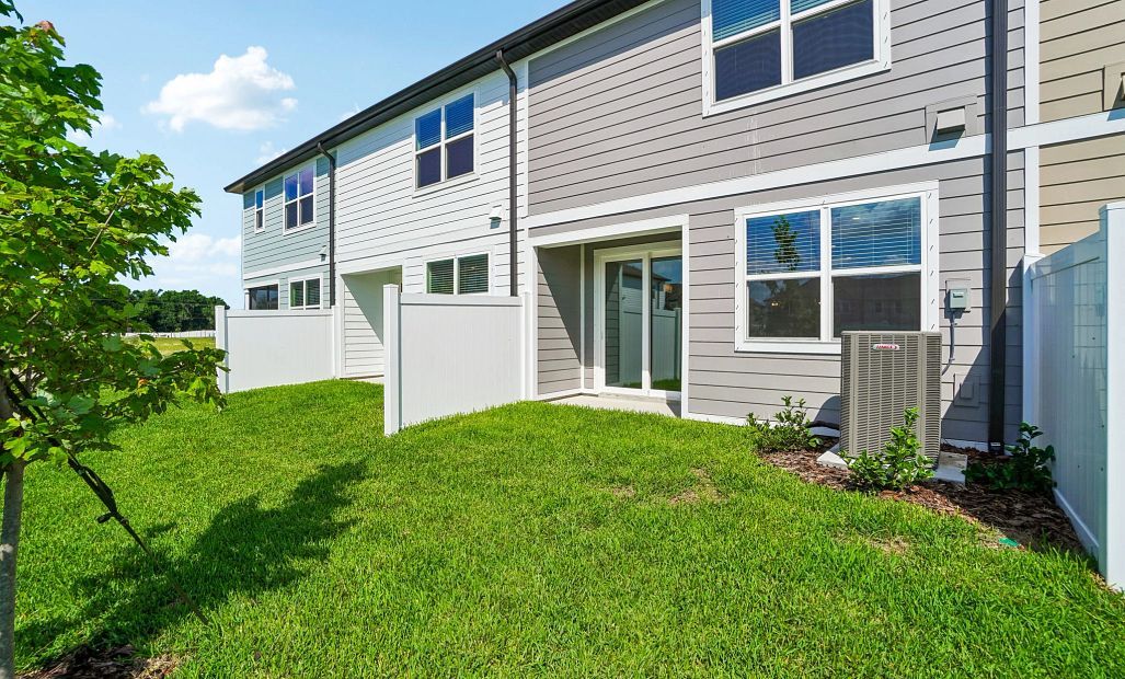 Spacious backyard with privacy fence