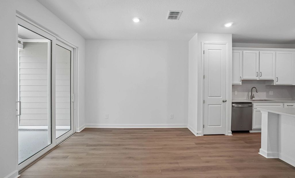 Dining space located off the kitchen and looks out on to the covered lanai