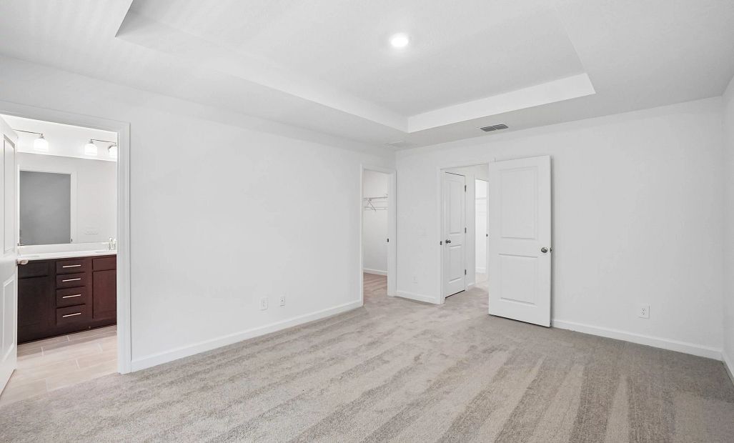 Primary bedroom features a separate bathroom and walk-in closet