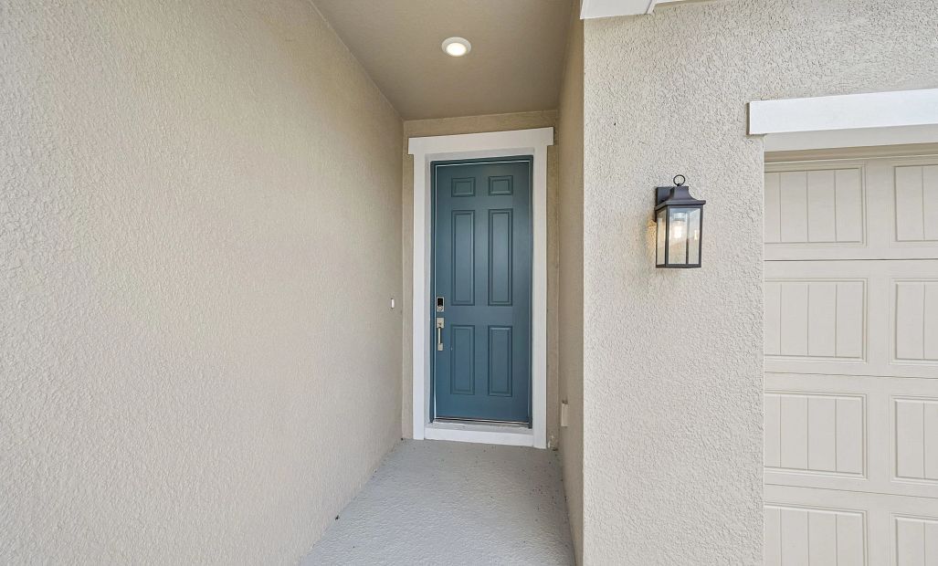 Covered front porch welcomes you into the home