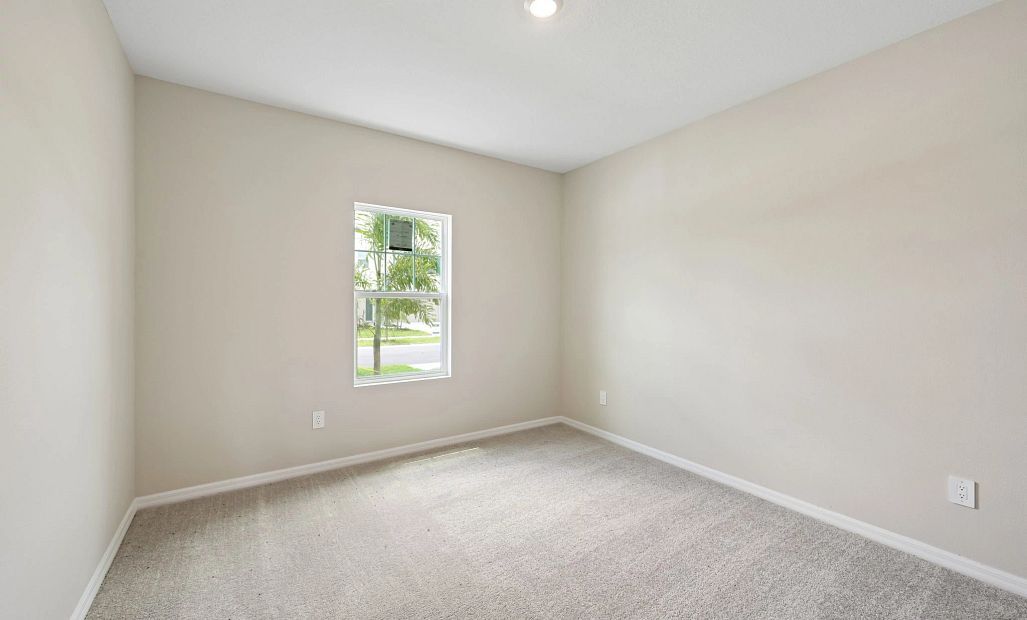 Bedroom 3 is located at the front of the house off the foyer