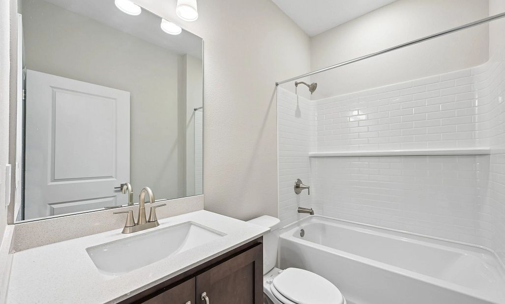 Bathroom 2 is located off the hallway near bedroom 3 and features aspects of our AW Collection®
