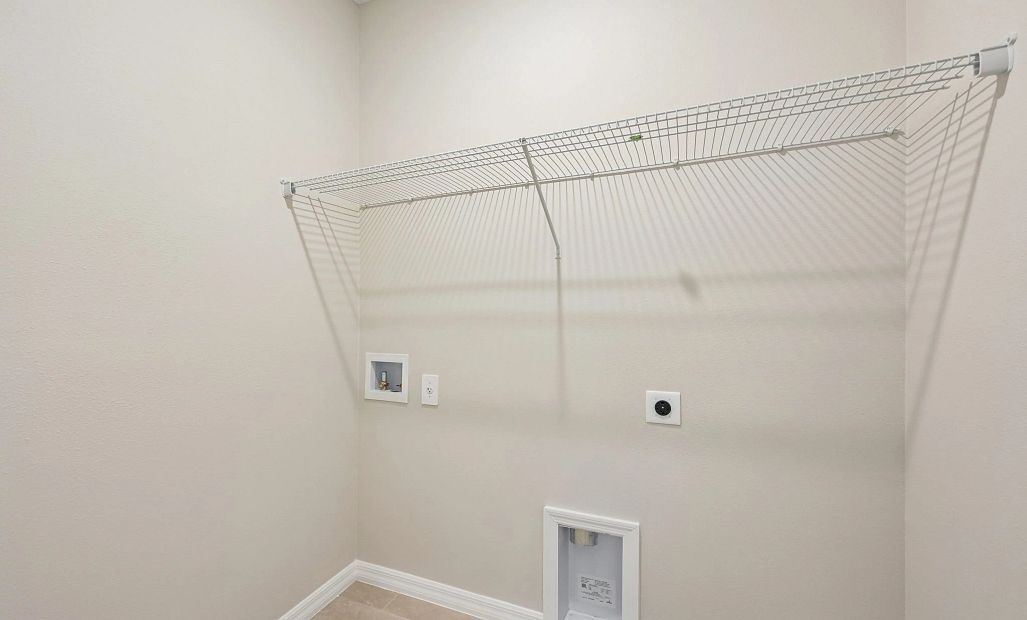 Laundry room is located off the hallway near the two car garage