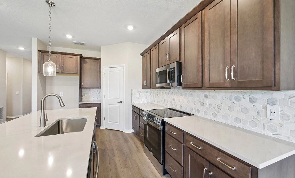 This beautiful AW Collection® Roosevelt kitchen comes with stainless steel appliances and plenty of