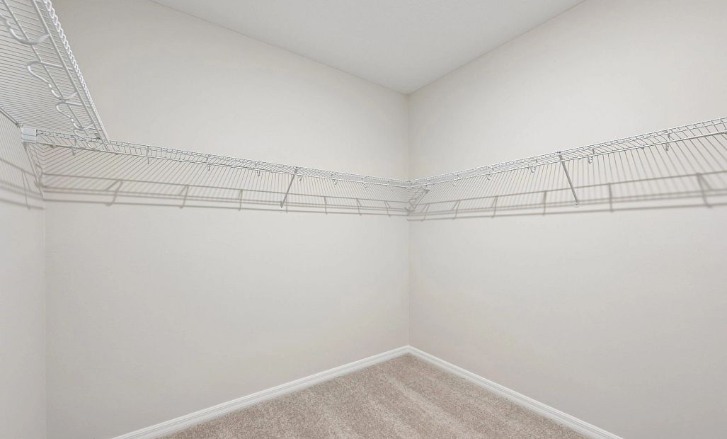 Oversized walk-in closet located off the primary bathroom