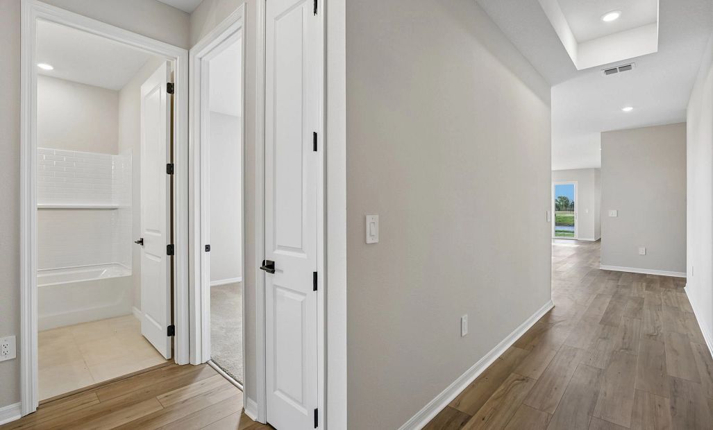 Foyer into the home welcomes you with a beautiful tray ceiling