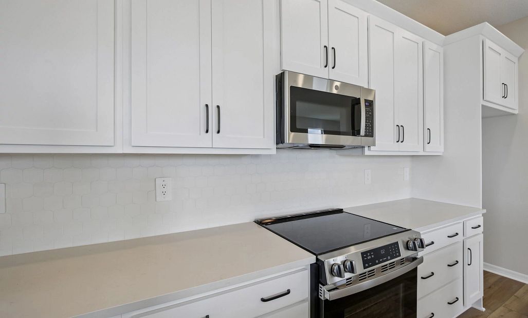 The AW Collection® Harmony is a classic white cabinet with a stunning backsplash and countertop