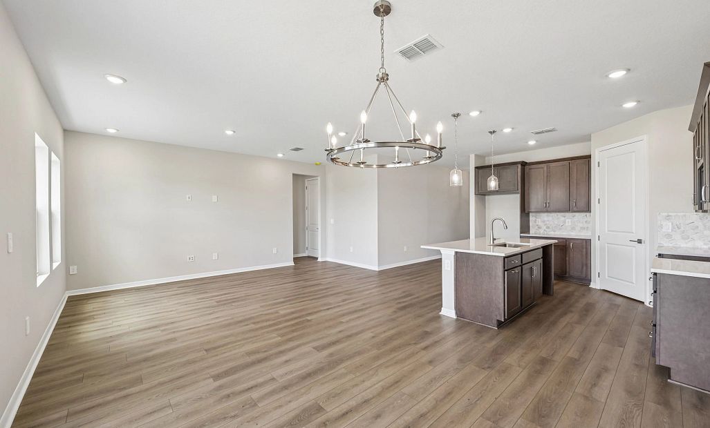 The dining space is located off the kitchen and opens into the rest of the room