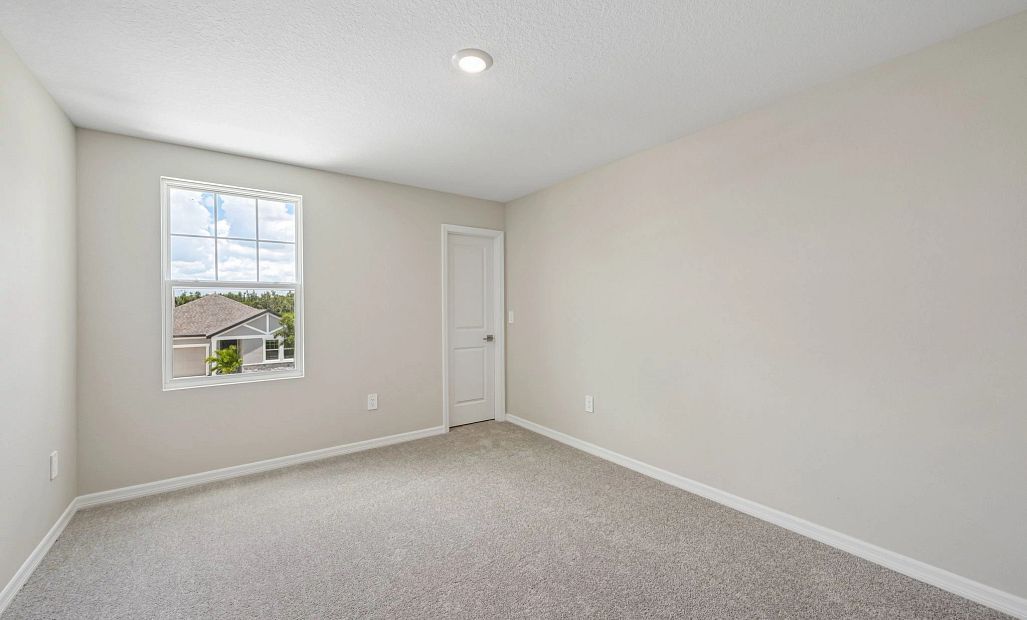 Bedroom 3 is located just down the hall from bedroom 2